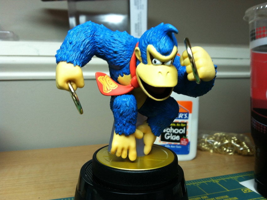 blue_fur dankey_kang donkey_kong figure full_body highres holding_object meme necktie open_mouth photo