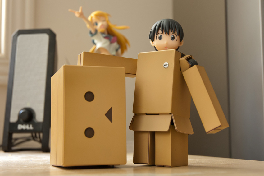 black_eyes black_hair box cardboard_box copyright_name danboo dell figure full_body minimized photo revoltech standing triangle_mouth yotsubato!