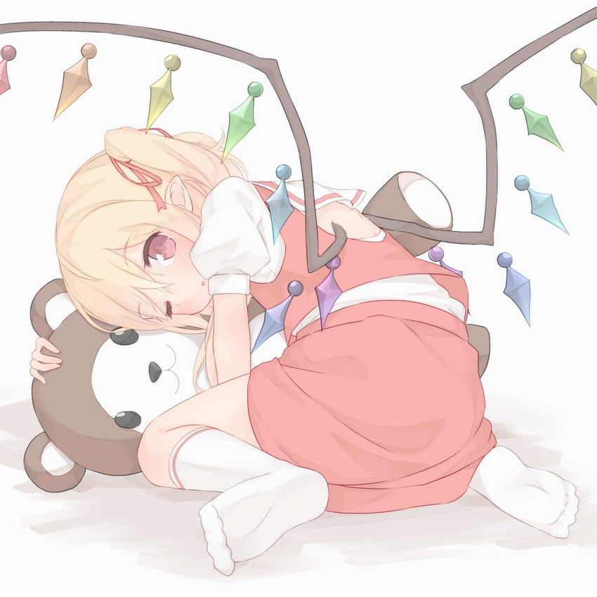 back_cutout blonde_hair flandre_scarlet full_body hair_ribbon highres looking_at_viewer one_eye_closed pointy_ears puffy_short_sleeves puffy_sleeves red_eyes red_ribbon red_skirt ribbon sakurea short_sleeves simple_background sitting skirt skirt_set socks solo stuffed_animal stuffed_toy teddy_bear touhou vest wariza white_background white_legwear wings