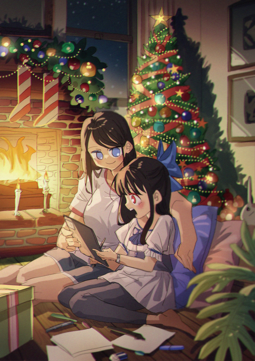 2girls blue_eyes blue_ribbon christmas christmas_ornaments christmas_tree dress fireplace highres holding holding_tablet_pc long_hair multiple_girls original ribbon sitting tablet_pc white_dress yumna_hutoyo