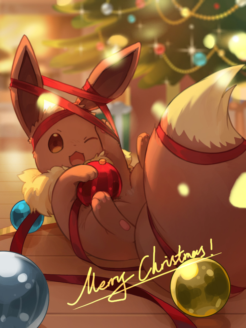 ;d blurry blurry_background brown_eyes christmas christmas_ornaments commentary_request eevee highres indoors lying merry_christmas on_back one_eye_closed open_mouth pokemon red_ribbon ribbon shine_cheese smile sparkle