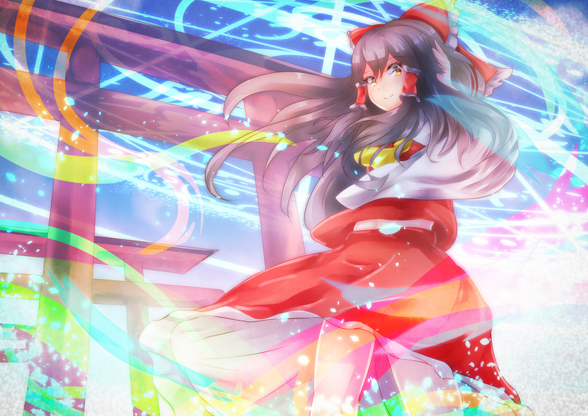ascot black_hair blush bow brown_hair closed_mouth commentary_request cowboy_shot detached_sleeves hair_between_eyes hair_bow hair_tubes hair_tucking hakurei_reimu highres lesshat light_particles long_hair looking_at_viewer multiple_torii nontraditional_miko red_bow red_skirt sidelocks skirt skirt_set smile solo torii touhou wide_sleeves yellow_eyes