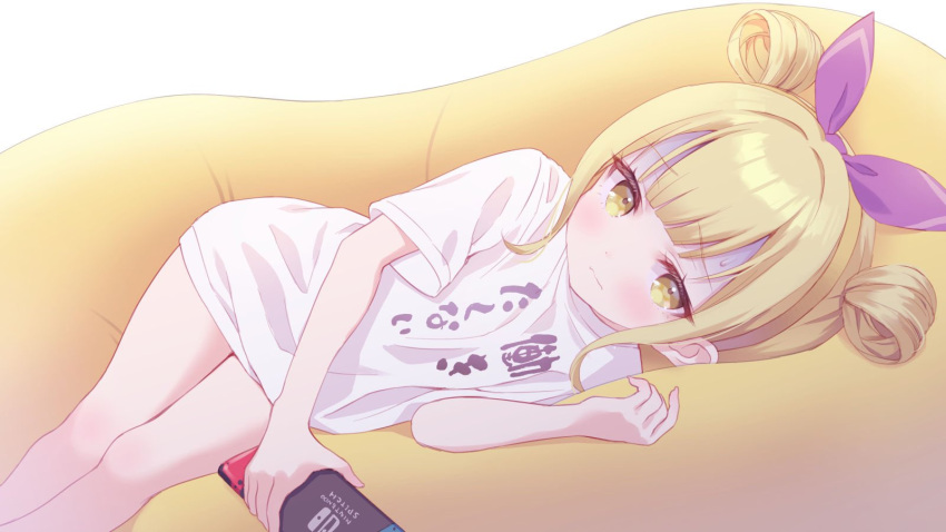 1girl blonde_hair blush chitosezaka_suzu closed_mouth clothes_writing commentary_request commission copyright_request double_bun feet_out_of_frame hair_bun hair_ribbon hand_up highres holding looking_at_viewer lying nintendo_switch on_side purple_ribbon ribbon shirt short_sleeves sidelocks skeb_commission solo sweat white_background white_shirt yellow_eyes