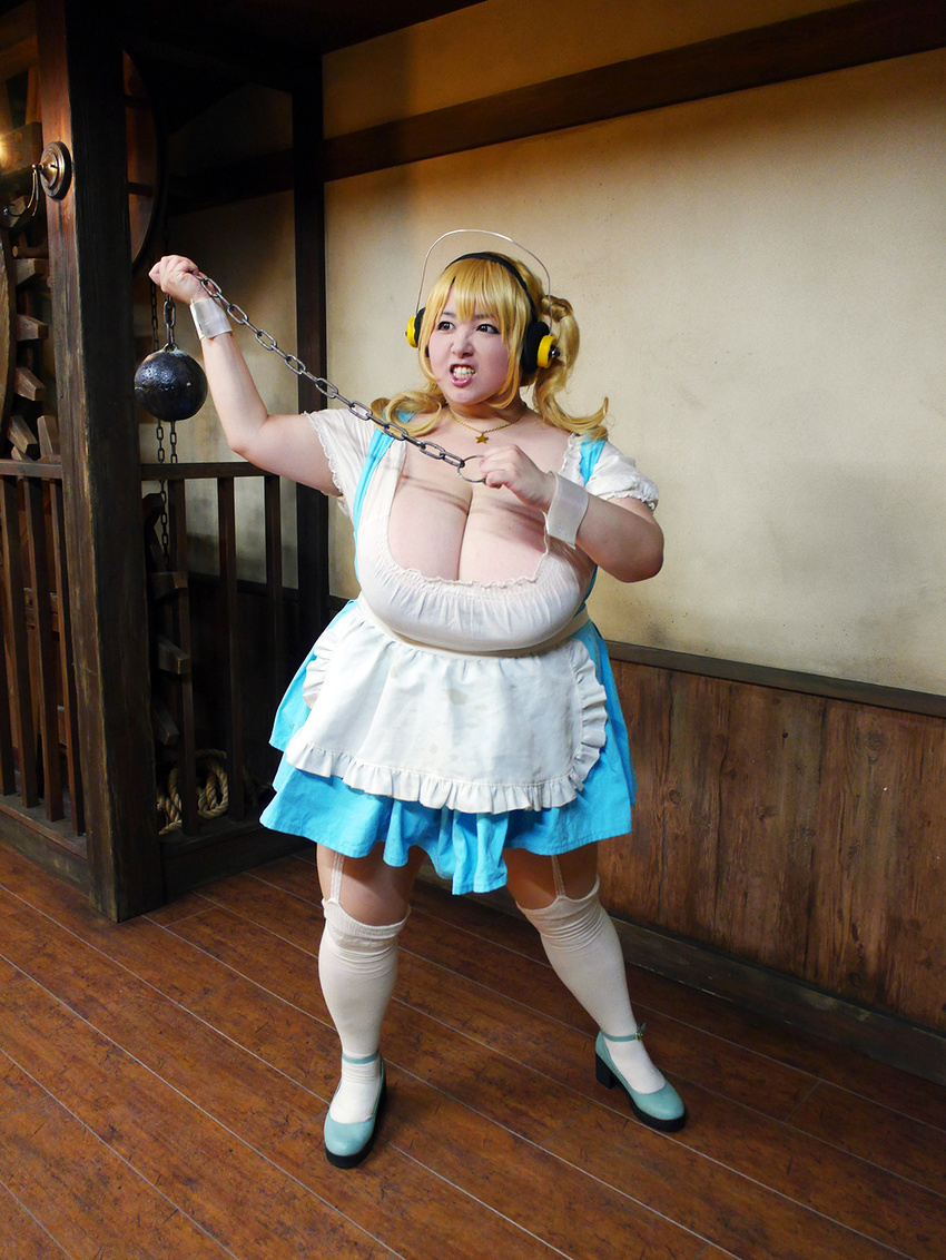 1girl asian blonde_hair breasts brown_eyes cleavage cosplay fat headphones hoshima_mika huge_breasts jewelry necklace nitroplus photo solo star super_pochaco super_pochaco_(cosplay) twintails