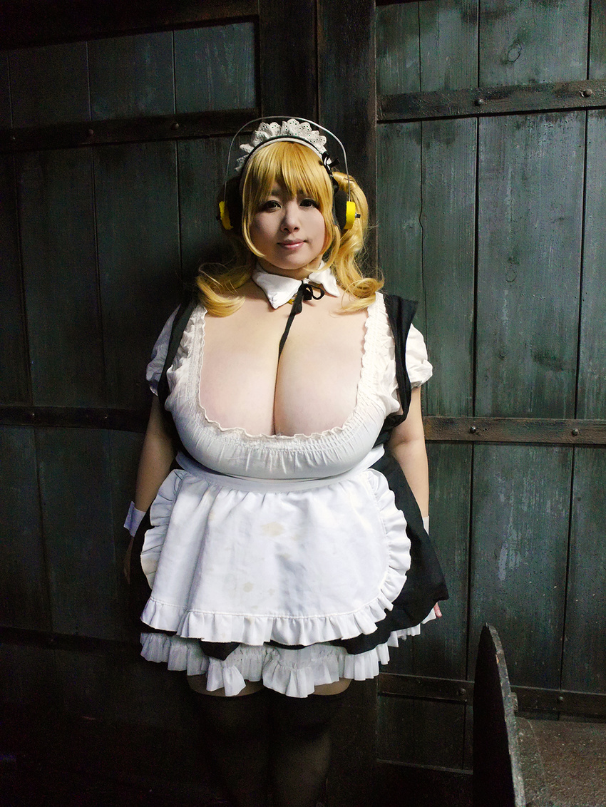 1girl asian blonde_hair breasts brown_eyes cleavage cosplay fat headphones hoshima_mika huge_breasts jewelry necklace nitroplus photo solo star super_pochaco super_pochaco_(cosplay) twintails