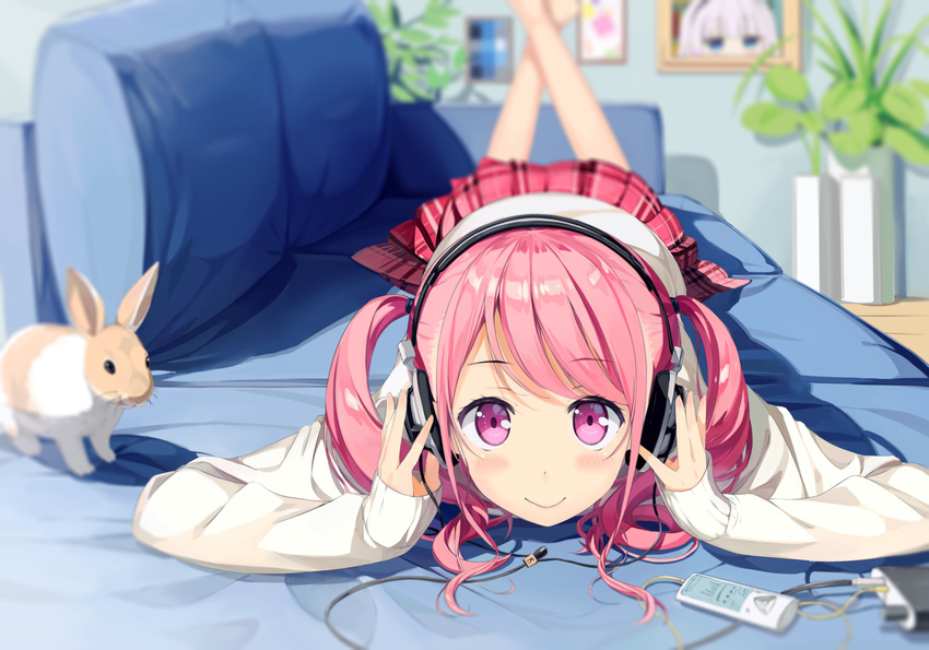 araragikoyomis bangs barefoot blurry blurry_background blush bunny checkered checkered_skirt closed_mouth commentary_request couch depth_of_field derivative_work digital_media_player dot_nose eyebrows_visible_through_hair feet_out_of_frame hands_on_headphones headphones highres indoors legs_up long_hair long_sleeves looking_at_viewer lying on_couch on_stomach original pink_eyes pink_hair plant pleated_skirt portrait_(object) potted_plant red_skirt skirt smile solo sweater swept_bangs two_side_up white_sweater