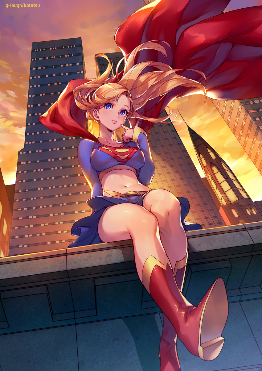 arm_support artist_name bangs belt blonde_hair blue_eyes blue_skirt blush breasts bright_pupils building cape cityscape closed_mouth commentary_request cropped_shirt day dc_comics feet_out_of_frame floating_hair from_below highres kotatsu_(g-rough) legs_together lips long_hair long_sleeves looking_at_viewer medium_breasts midriff navel outdoors pink_lips pleated_skirt red_cape sitting skirt skyscraper solo sunset supergirl superhero yellow_sky