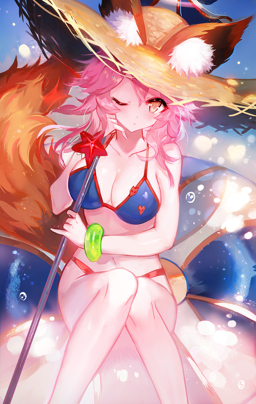 animal_ears bangs beach_umbrella bikini blue_bikini blush breasts closed_mouth collarbone commentary_request ears_through_headwear fate/grand_order fate_(series) fox_ears fox_print fox_tail hair_between_eyes hat highres holding holding_umbrella innertube knees_up large_breasts long_hair looking_at_viewer moemoe3345 navel one_eye_closed pink_hair sitting solo straw_hat sun_hat swimsuit tail tamamo_(fate)_(all) tamamo_no_mae_(swimsuit_lancer)_(fate) umbrella yellow_eyes