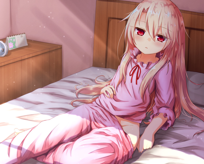 arm_support baram bed_sheet blonde_hair calendar_(object) fate/kaleid_liner_prisma_illya fate_(series) hair_between_eyes half-closed_eyes illyasviel_von_einzbern indoors long_hair long_sleeves looking_at_viewer no_panties on_bed pajamas pajamas_pull pillow reclining red_eyes red_ribbon ribbon sidelocks sitting solo sunlight