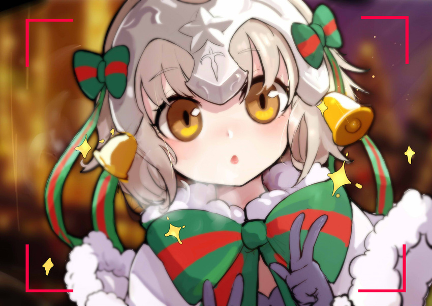 bangs bell black_gloves blurry blurry_background blush bow brown_eyes capelet chestnut_mouth christmas commentary_request depth_of_field double_v eyebrows_visible_through_hair fate/grand_order fate_(series) fur-trimmed_capelet fur_trim gloves green_bow green_ribbon headpiece highres jeanne_d'arc_(fate)_(all) jeanne_d'arc_alter_santa_lily kiyomasa_ren leaning_to_the_side looking_at_viewer parted_lips ribbon solo sparkle striped striped_bow striped_ribbon v viewfinder white_capelet