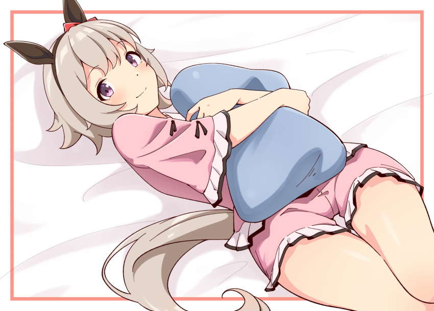 1girl animal_ears black_hairband blush bow closed_mouth commentary_request curren_chan_(umamusume) ear_bow ear_covers grey_hair hair_between_eyes hairband highres horse_ears horse_girl horse_tail hugging_object lying motsutoko on_back pajamas pillow pillow_hug pink_pajamas pink_shirt pink_shorts purple_eyes red_bow shirt short_hair short_sleeves shorts smile solo tail thighs umamusume