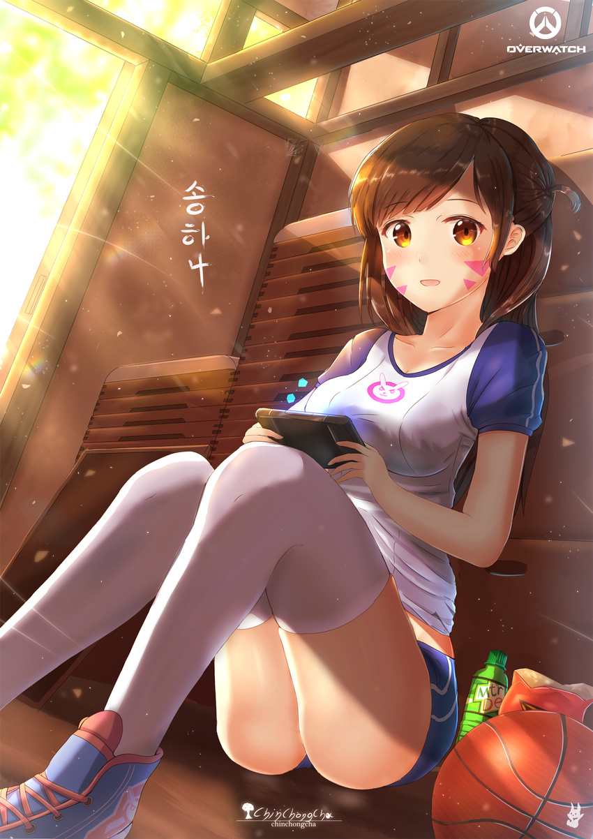 bangs brown_eyes brown_hair chinchongcha collarbone d.va_(overwatch) day eyebrows_visible_through_hair facepaint facial_mark gym_storeroom handheld_game_console highres indoors long_hair looking_at_viewer open_mouth overwatch shorts sitting swept_bangs thighhighs whisker_markings