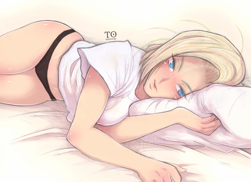 android_18 antiheld artist_name bed black_panties blonde_hair blue_eyes commentary covered_nipples dragon_ball dragon_ball_z highres looking_at_viewer lying on_side panties pillow shirt simple_background solo underwear white_shirt