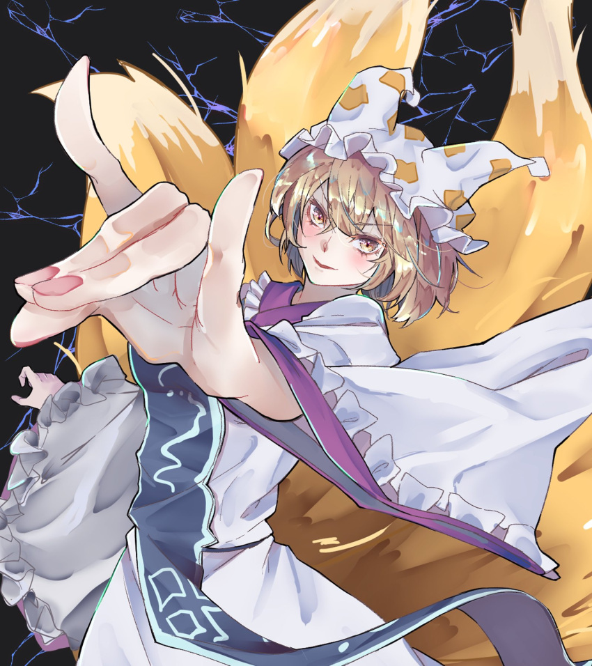 1girl animal_ears black_background blonde_hair blush dress fox_ears fox_shadow_puppet fox_tail highres kanaria_(bocmn) kitsune long_sleeves looking_at_viewer multiple_tails short_hair solo tabard tail touhou white_dress white_headwear wide_sleeves yakumo_ran yellow_eyes