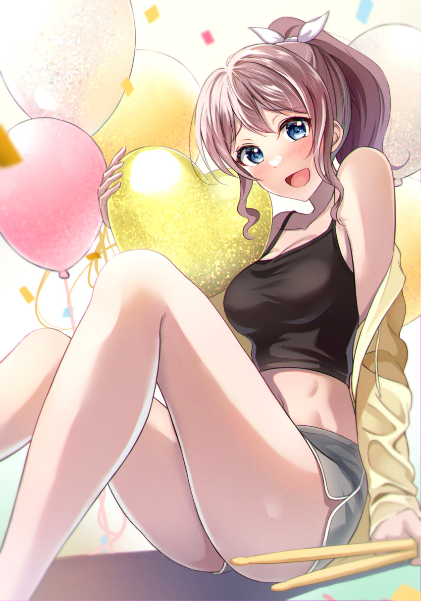 1girl aranami_shibuki balloon bang_dream! bare_shoulders black_camisole blue_eyes blue_shorts breasts brown_hair camisole drumsticks heart_balloon highres holding holding_drumsticks long_hair looking_at_viewer medium_breasts midriff open_mouth ponytail short_shorts shorts sidelocks sitting smile solo yamabuki_saya