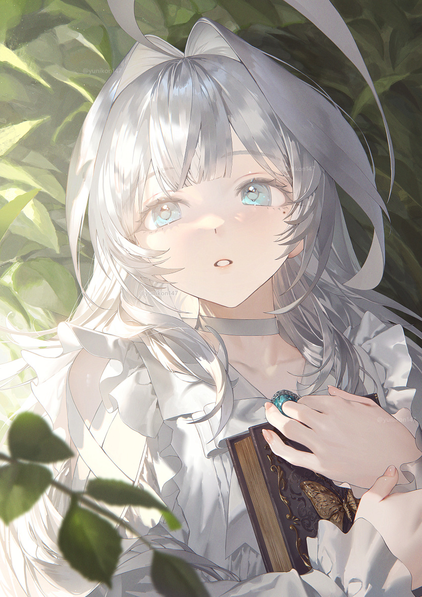 1girl absurdres ahoge blue_eyes blunt_bangs blurry blurry_foreground book commentary_request facing_viewer frills grey_choker grey_hair hair_intakes highres holding holding_book huge_ahoge hugging_book hugging_object leaf long_hair looking_up mole mole_under_eye original parted_lips solo twitter_username upper_body yunikon