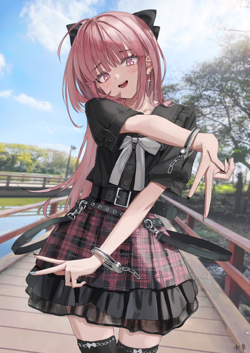 1girl ahoge belt black_belt blurry blurry_background bow cowboy_shot cross cross_earrings cuffs earrings frills hair_bow handcuffs highres jewelry looking_at_viewer nadegata open_mouth original outdoors pink_eyes pink_hair plaid plaid_skirt pleated_skirt skirt solo standing zettai_ryouiki