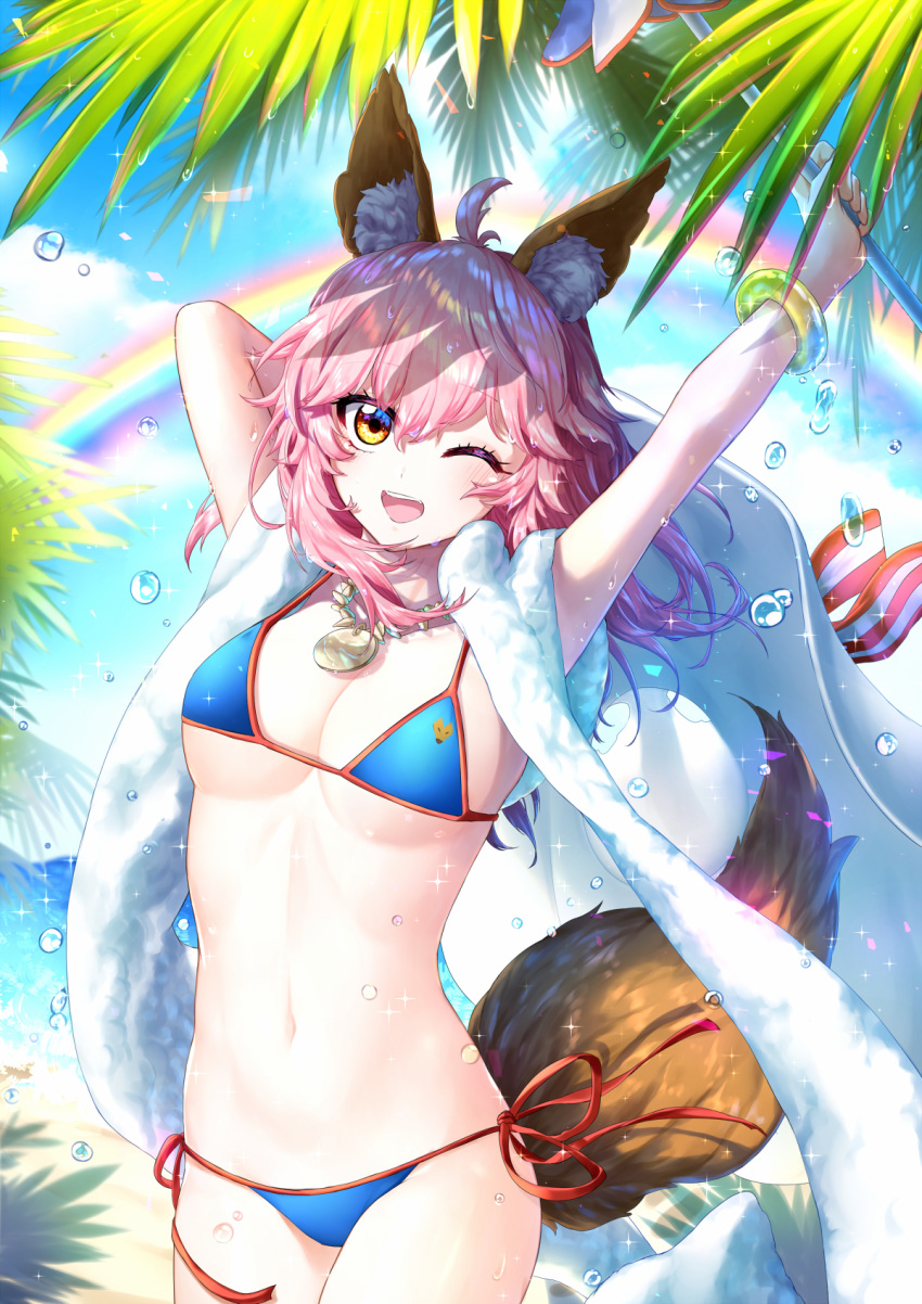 ;d ahoge arms_up bangle bangs beach_towel bikini blue_bikini blue_sky blush bracelet breasts brown_eyes cleavage collarbone cowboy_shot day eyebrows_visible_through_hair fate/grand_order fate_(series) food fox_tail highres hm_(wonhml) holding jewelry large_breasts long_hair navel necklace one_eye_closed open_mouth outdoors palm_tree pendant pink_hair rainbow red_ribbon ribbon side-tie_bikini sky smile solo sparkle standing stomach strap_gap string_bikini swimsuit tail tail_raised tamamo_(fate)_(all) tamamo_no_mae_(swimsuit_lancer)_(fate) towel towel_around_neck tree water_drop