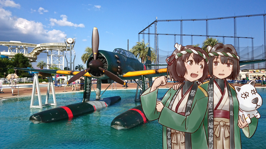 aircraft airplane black_shirt brown_eyes brown_hair clothes_writing cowboy_shot doll e16a_zuiun gambier_bay_(kantai_collection) hachimaki hair_ribbon happi headband hyuuga_(kantai_collection) ise_(kantai_collection) japanese_clothes kantai_collection karasu_(naoshow357) multiple_girls open_mouth photo_background ponytail red_ribbon ribbon shirt short_hair undershirt