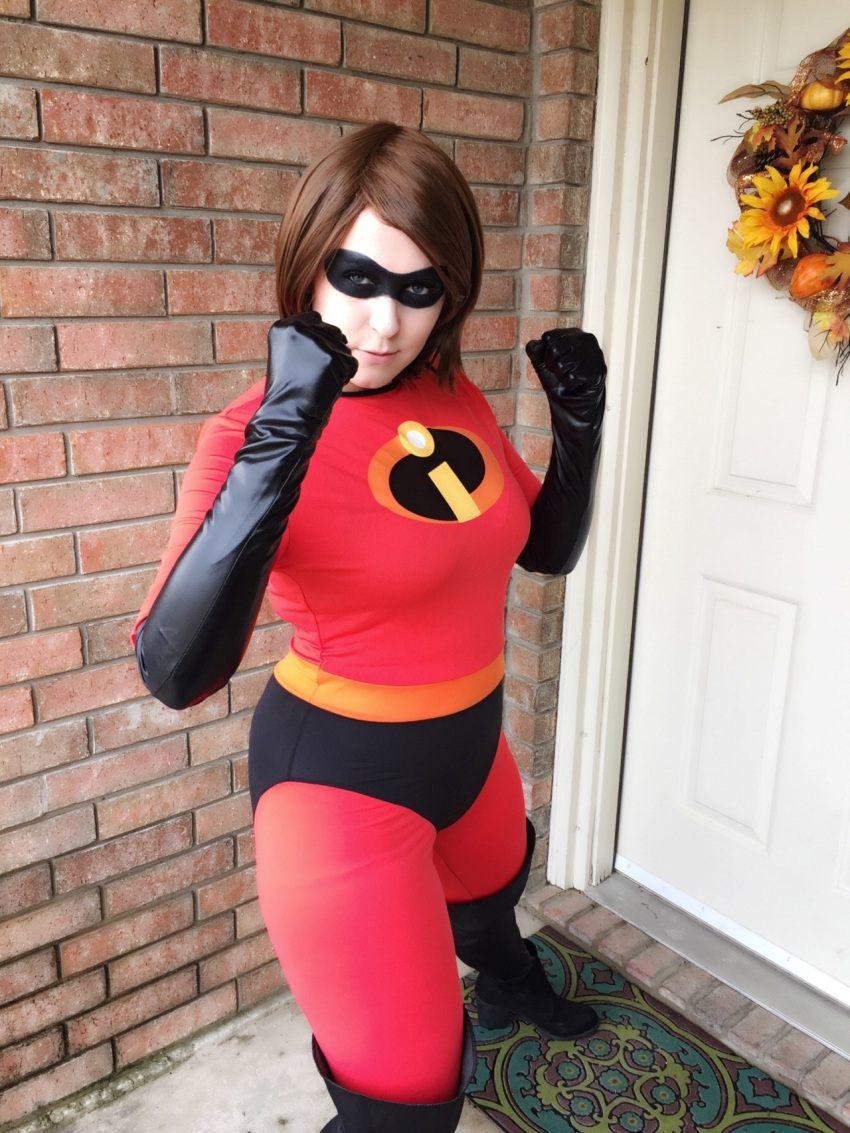 1girl ass bodysuit boots breasts brown_eyes brown_hair cosplay costume domino_mask elastigirl female helen_parr legs mask photo short_hair skin_tight solo the_incredibles