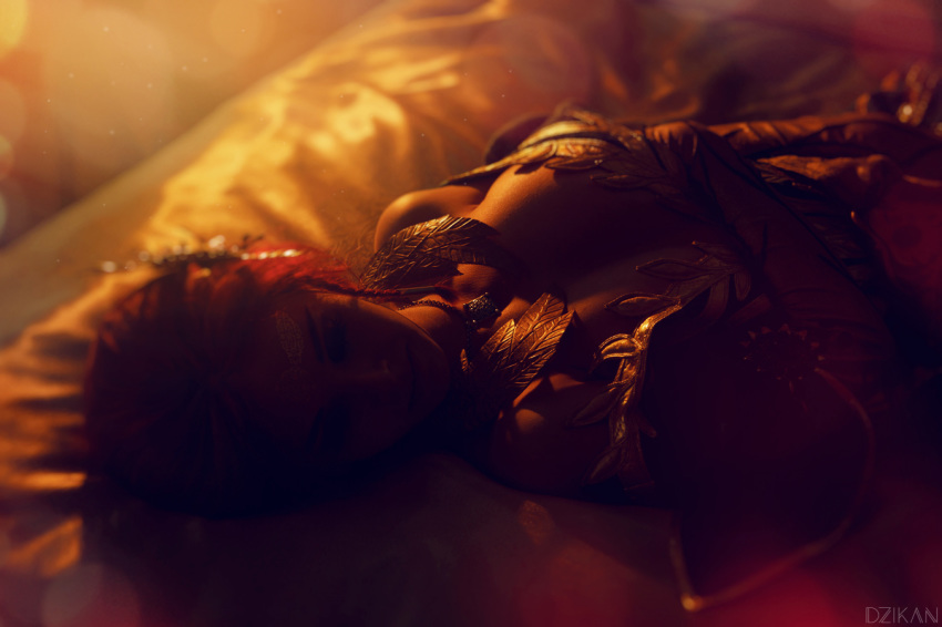 1girl blurry circlet cosplay costume depth_of_field dress helly_von_valentine_(disharmonica) indoors jewelry lying makeup necklace no_bra off_shoulder on_back parted_lips pendant photo red_hair robe side_braids solo the_witcher triss_merigold upper_body
