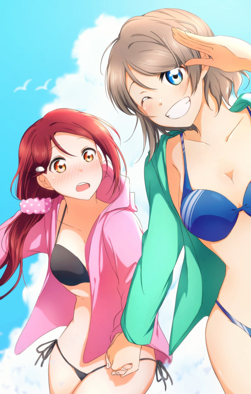 2girls bare_shoulders bikini black_bikini blue_bikini blue_eyes blush breasts cleavage collarbone day green_jacket grey_hair grin hair_ornament hair_over_shoulder hairclip hand_holding highres hood hood_down hooded_jacket jacket long_hair long_sleeves looking_at_another looking_at_viewer love_live! love_live!_sunshine!! low-tied_long_hair multiple_girls nose_blush one_eye_closed outdoors pink_jacket pink_scrunchie polka_dot polka_dot_scrunchie red_hair sakurauchi_riko salute scrunchie short_hair side-tie_bikini smile swimsuit watanabe_you yellow_eyes yuchi_(salmon-1000)