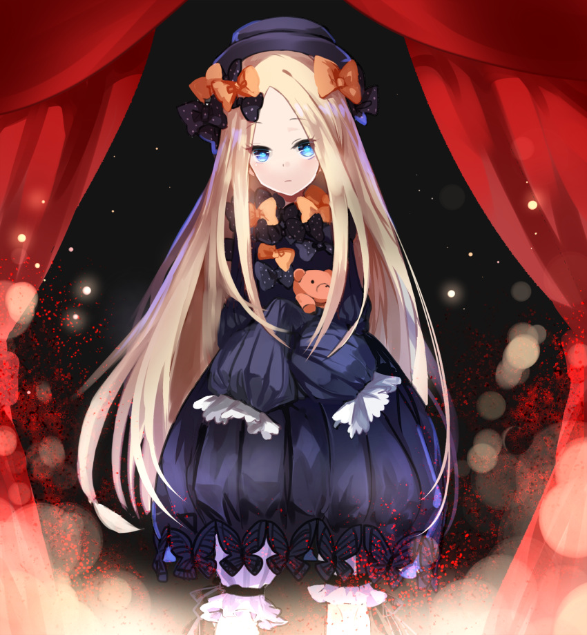 abigail_williams_(fate/grand_order) bangs black_bow black_dress black_hat blonde_hair bloomers blue_eyes bow closed_mouth commentary_request dress fate/grand_order fate_(series) hair_bow hat highres holding holding_stuffed_animal light_particles long_hair looking_at_viewer object_hug orange_bow parted_bangs pekerika polka_dot polka_dot_bow purple_bow sleeves_past_fingers sleeves_past_wrists solo stage_curtains stuffed_animal stuffed_toy teddy_bear underwear very_long_hair white_bloomers