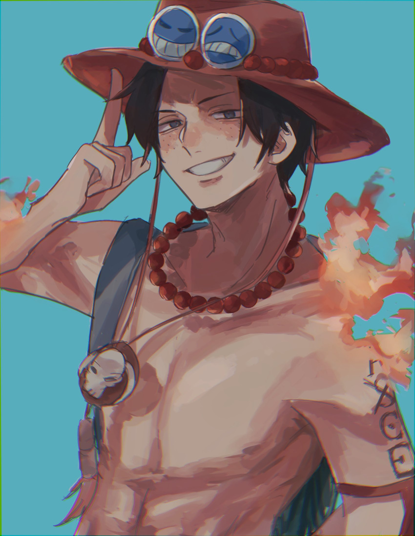 1boy black_hair blue_background chest_tattoo elbow_pads english_commentary fire freckles highres jewelry looking_at_viewer machida_0906 male_focus necklace one_piece orange_headwear portgas_d._ace simple_background smile solo tattoo topless_male