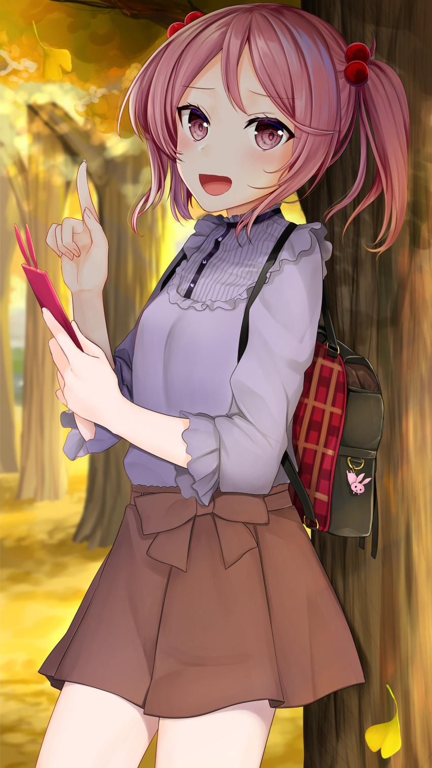absurdres against_tree alternate_costume autumn_leaves backpack bag blouse brown_skirt bunny cellphone commentary_request cowboy_shot hair_bobbles hair_ornament highres kantai_collection looking_at_viewer open_mouth phone pink_eyes pink_hair purple_blouse sazanami_(kantai_collection) short_hair skirt smile solo tree twintails yunamaro