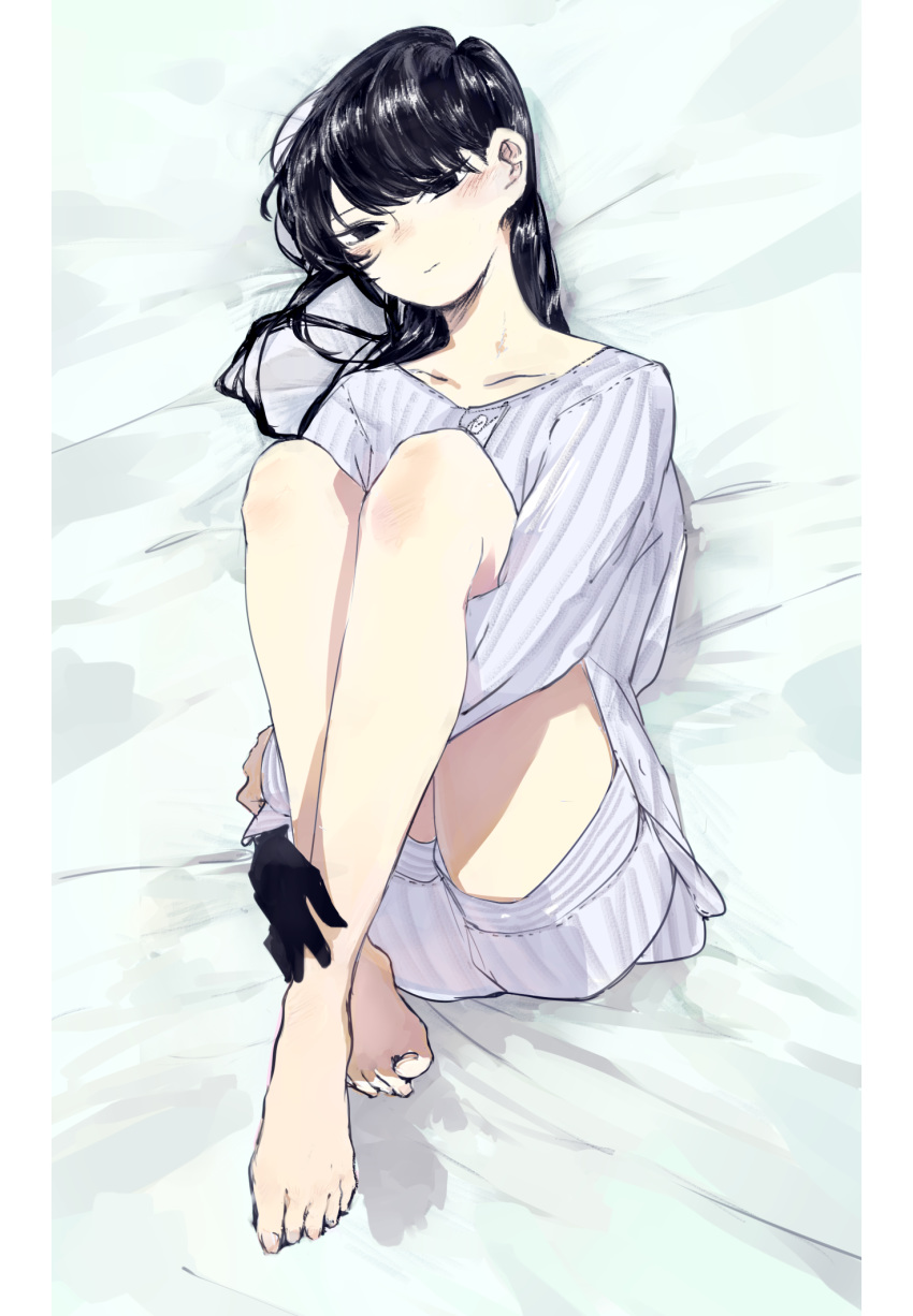 barefoot bed_sheet black_eyes black_gloves black_hair blush closed_mouth collarbone from_above full_body gloves hantasy1 highres knees_up komi-san_wa_komyushou_desu komi_shouko leg_hug long_hair long_sleeves looking_at_viewer lying on_back pajamas shorts single_glove solo toes