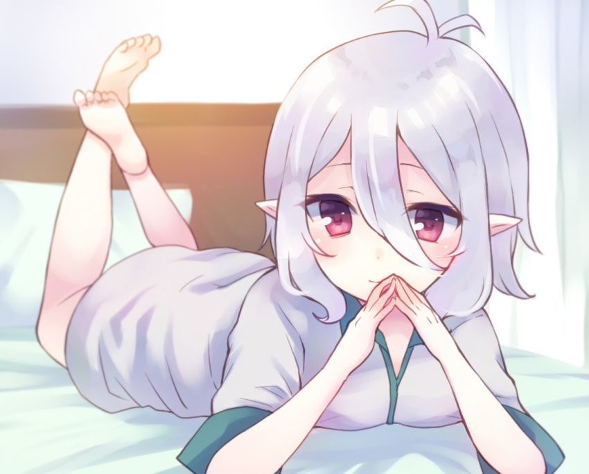 bangs barefoot bed blush closed_mouth commentary_request dress eyebrows_behind_hair grey_dress gucchiann hair_between_eyes hands_up indoors kokkoro_(princess_connect!) legs_up looking_at_viewer lying on_bed on_stomach pillow pointy_ears princess_connect! princess_connect!_re:dive red_eyes short_sleeves silver_hair smile soles solo the_pose