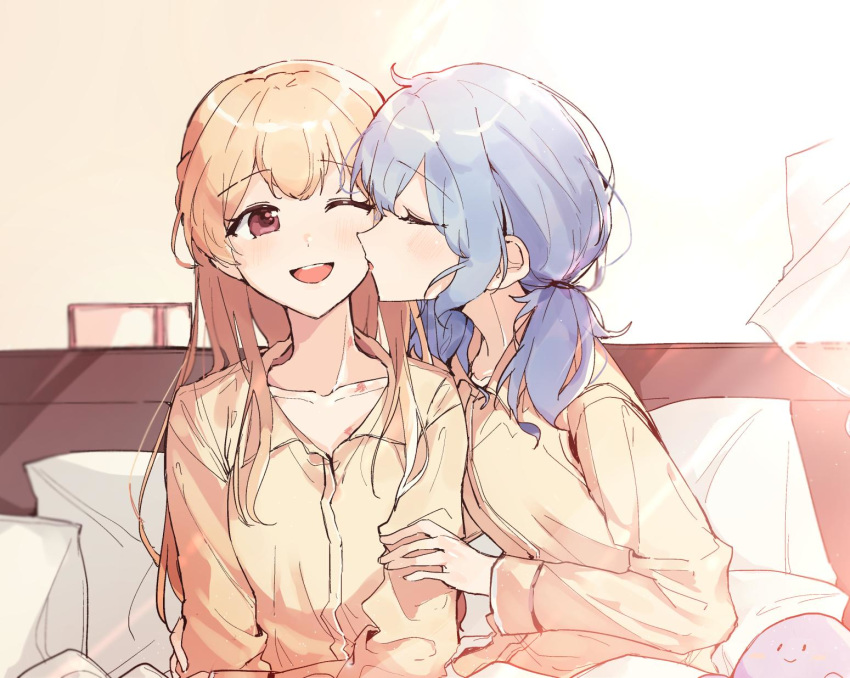 2girls ;d alternate_hairstyle aqua_hair bang_dream! bangs bed blonde_hair cheek_kiss collarbone commentary_request eyebrows_visible_through_hair eyes_closed hanazono_suki hand_on_another's_arm highres indoors kiss long_hair long_sleeves matsubara_kanon messy_hair multiple_girls one_eye_closed open_mouth pajamas pillow purple_eyes red_eyes shirasagi_chisato sitting smile stuffed_toy twintails under_covers yellow_pajamas yuri