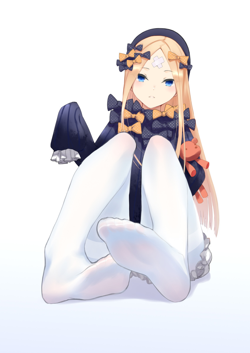 1girl abigail_williams_(fate/grand_order) absurdres bandaid_on_forehead bangs black_bow black_dress black_headwear blonde_hair blue_eyes blush bow c.rabbit closed_mouth crossed_bandaids dress fate/grand_order fate_(series) feet forehead hair_bow highres holding holding_stuffed_animal legs long_hair long_sleeves looking_at_viewer orange_bow pantyhose parted_bangs polka_dot polka_dot_bow simple_background sitting sleeves_past_fingers sleeves_past_wrists soles solo stuffed_animal stuffed_toy teddy_bear thighband_pantyhose toes white_background white_bloomers white_legwear