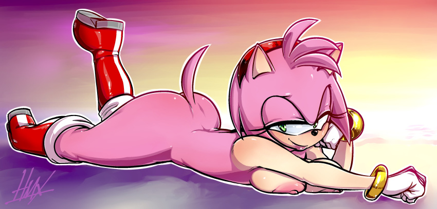 amy_rose anthro areola arm_support beach bedroom_eyes big_butt blush boots bracelet breasts bubble_butt butt clothing eulipotyphlan female footwear glistening glistening_skin gloves green_eyes hairband half-closed_eyes hedgehog hi_res hmx_(artist) jewelry leaning_on_elbow lipstick looking_at_viewer lying makeup mammal mostly_nude nipples on_front one_leg_up pinup pose raised_leg sea seaside seductive signature smile solo sonic_(series) sunset thick_thighs water