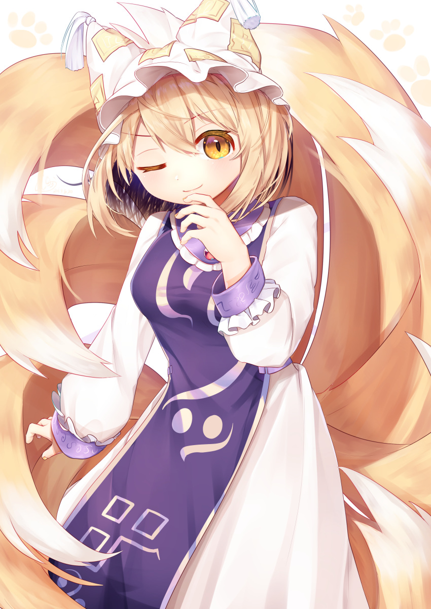 1girl absurdres arm_up blonde_hair breasts contrapposto cowboy_shot dress eyebrows_visible_through_hair finger_to_chin fox_tail gunjou_row hair_between_eyes hat hat_with_ears highres long_sleeves medium_breasts multiple_tails nail_polish ofuda one_eye_closed orange_nails paw_background short_hair sleeve_cuffs slit_pupils smile solo standing tabard tail tassel touhou white_background white_dress yakumo_ran yellow_eyes