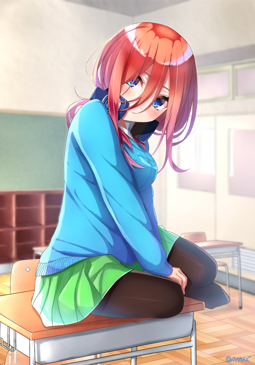 1girl absurdres bangs blue_cardigan blue_eyes blurry blurry_background blush breasts brown_hair brown_legwear cardigan chair closed_mouth collared_shirt commentary_request depth_of_field desk eyebrows_behind_hair go-toubun_no_hanayome green_skirt hair_between_eyes head_tilt headphones headphones_around_neck highres honorikiti indoors long_hair looking_at_viewer medium_breasts nakano_miku no_shoes on_desk pantyhose pleated_skirt school_chair school_desk shirt sitting sitting_on_desk skirt smile solo twitter_username white_shirt wooden_floor