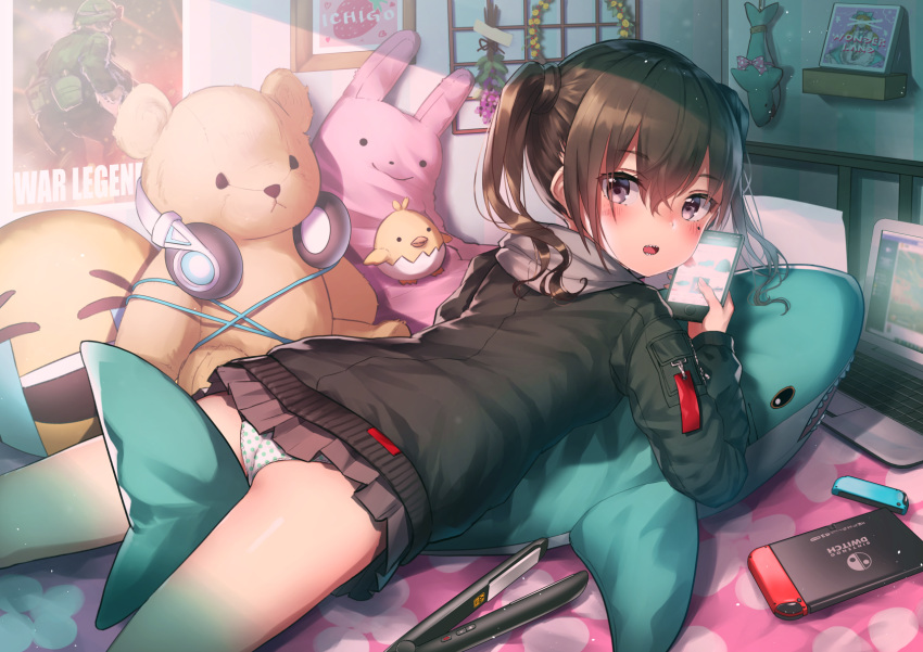 1girl ass bed black_jacket blush brown_hair brown_skirt cable cellphone computer cowboy_shot emoji from_behind headphones highres holding holding_phone hood hooded_jacket idolmaster idolmaster_cinderella_girls indoors jacket long_sleeves looking_at_viewer looking_back lying microskirt mole mole_under_eye nintendo_switch on_stomach open_mouth panties phone picture_frame pleated_skirt polka_dot polka_dot_panties poster_(object) purple_eyes pyonsuke_(pyon2_mfg) shadow sharp_teeth short_hair skirt smartphone solo stuffed_animal stuffed_bird stuffed_bunny stuffed_shark stuffed_toy sunazuka_akira teddy_bear teeth thighs twintails underwear white_panties