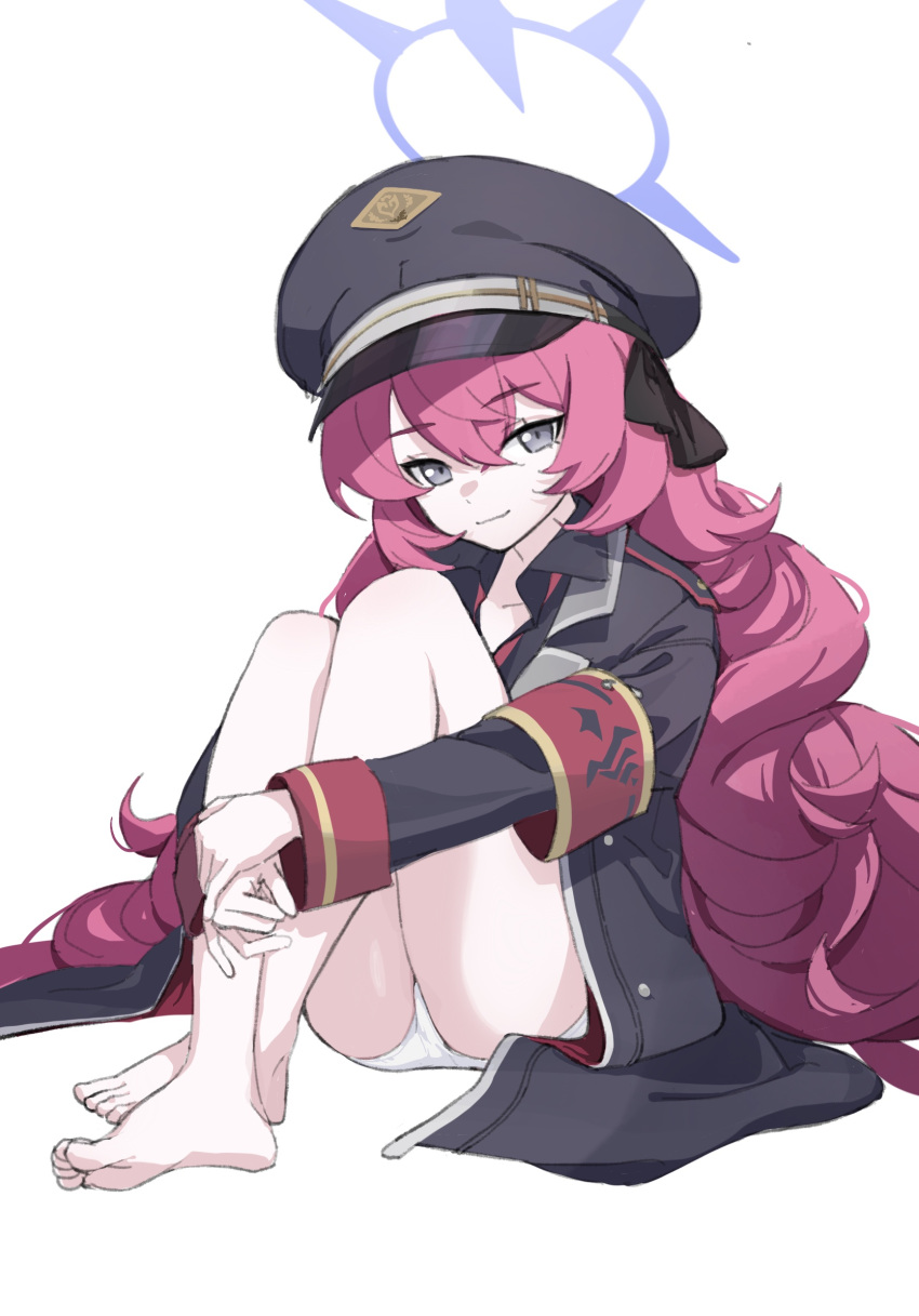 1girl armband barefoot black_coat blue_archive closed_mouth coat crossed_ankles feet full_body grey_eyes hair_between_eyes halo hat highres iroha_(blue_archive) knees_up kongbai_(sandpc) long_hair long_sleeves looking_at_viewer open_clothes open_coat panties peaked_cap red_armband red_hair simple_background sitting smile solo underwear very_long_hair white_background white_panties
