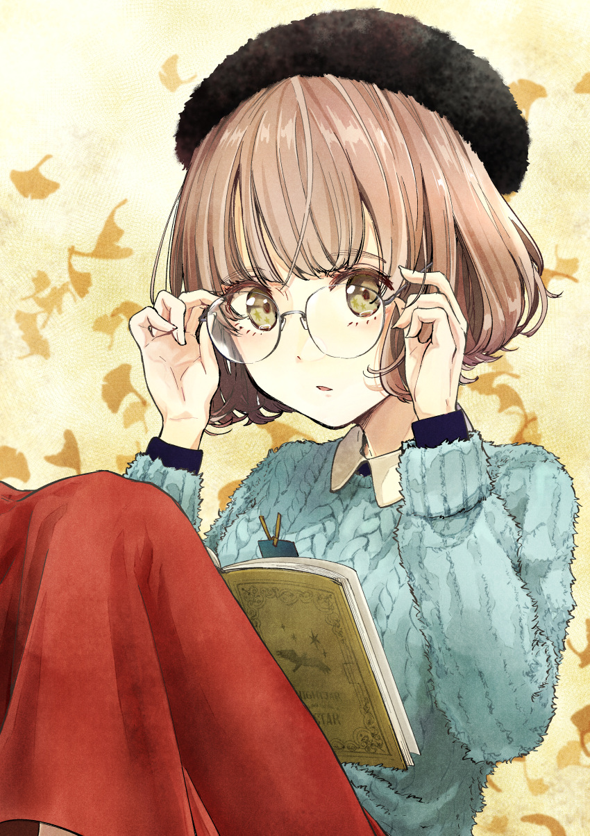 1girl absurdres adjusting_eyewear beret black_hat blue_sweater book bookmark brown_hair glasses green_eyes hat highres leaf leaf_background long_skirt open_book original parted_lips red_skirt short_hair skirt solo sweater tenacitysaho