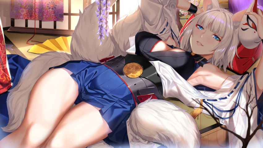 1girl animal_ears azur_lane bangs blue_eyes blue_skirt blunt_bangs blush breasts cleavage day deras eyebrows_visible_through_hair fox_ears fox_mask fox_tail hakama_skirt holding holding_mask indoors japanese_clothes kaga_(azur_lane) large_breasts light_particles looking_at_viewer lying mask multiple_tails off_shoulder on_back short_hair skirt smile solo tail white_hair wide_sleeves