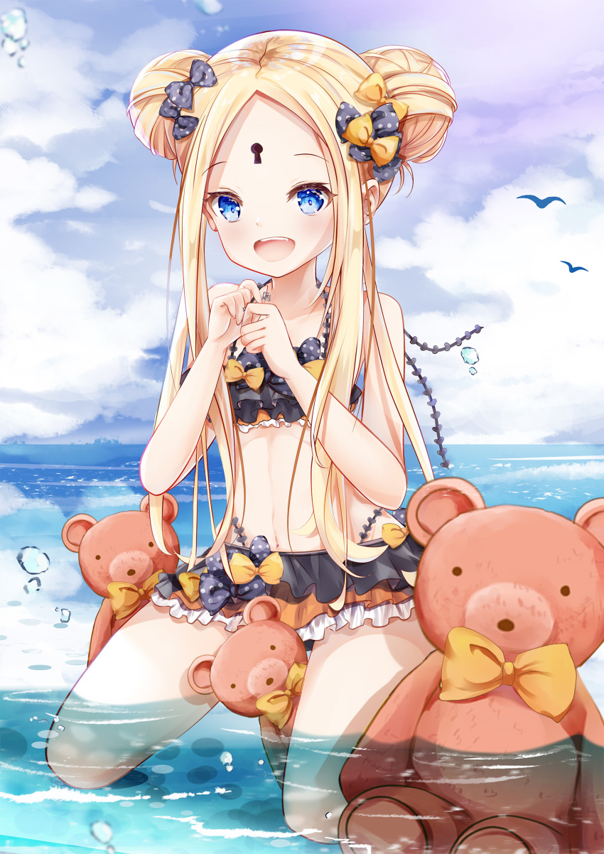 1girl :d abigail_williams_(fate/grand_order) bangs bare_arms bare_shoulders bikini black_bikini black_bow blonde_hair blue_eyes blue_sky blush bow cloud cloudy_sky collarbone commentary_request day double_bun emerald_float eyebrows_visible_through_hair fang fate/grand_order fate_(series) forehead full_body hair_bow hands_up highres holding holding_key horizon key keyhole kneeling long_hair looking_at_viewer mutang ocean open_mouth orange_bow outdoors parted_bangs polka_dot polka_dot_bow sidelocks sky smile solo stuffed_animal stuffed_toy swimsuit teddy_bear very_long_hair water