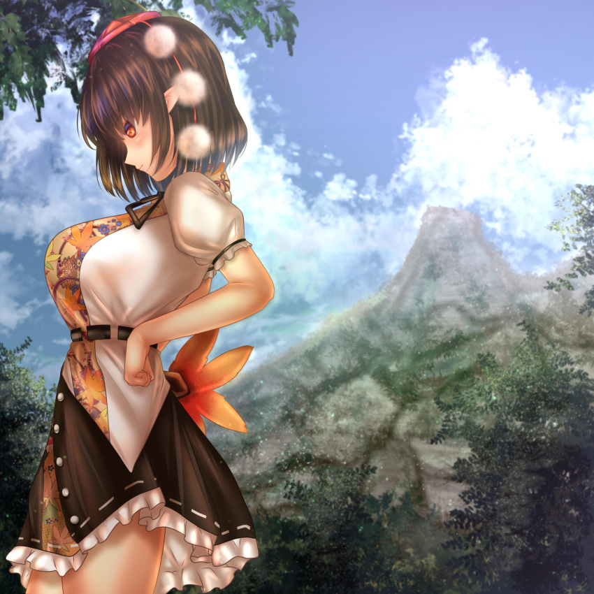 1girl arched_back belt black_hair black_skirt blue_sky breasts clenched_hand cloud commentary_request cowboy_shot day fan feather_fan forest from_side hands_on_hips hat highres holding holding_fan large_breasts leaf_print light_particles light_smile looking_down looking_to_the_side mountain nature outdoors petticoat pointy_ears pom_pom_(clothes) profile puffy_short_sleeves puffy_sleeves red_eyes shameimaru_aya shirt short_hair short_sleeves shounen_(hogehoge) skirt sky solo standing tokin_hat touhou tree untucked_shirt white_shirt youkai_mountain