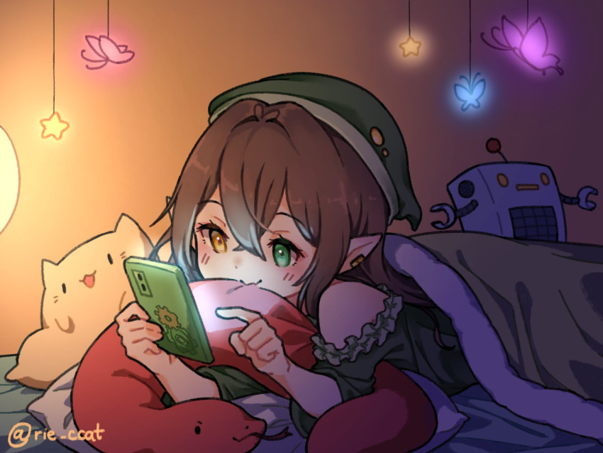 animal-shaped_pillow blanket brown_hair cellphone green_blanket green_headwear green_nightgown hat highres hojo_studio holding holding_phone monochrome nightgown phone pointy_ears rie_ccat sim_chan smartphone smile toy_robot under_covers virtual_youtuber