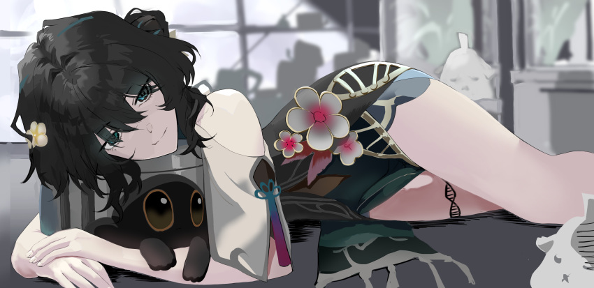 1girl bare_shoulders black_hair blue_eyes clothing_cutout commentary_request dress eyes_visible_through_hair feet_out_of_frame flower green_dress grey_flower hair_bun hair_flower hair_ornament hair_over_eyes highres honkai:_star_rail honkai_(series) indoors lying on_side pelvic_curtain ruan_mei_(honkai:_star_rail) short_sleeves shoulder_cutout single_side_bun solo torimahera white_flower