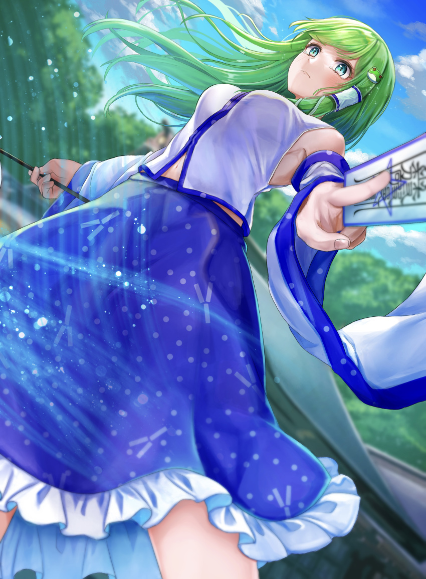 1girl absurdres armpit_peek bare_shoulders blue_skirt blue_sky blurry blurry_background blush breasts commentary_request cowboy_shot day detached_sleeves dutch_angle frilled_skirt frills frog_hair_ornament from_below gohei green_eyes green_hair hair_ornament highres holding holding_gohei holding_ofuda kochiya_sanae long_hair long_sleeves looking_at_viewer medium_breasts midriff_peek navel nontraditional_miko outdoors remitei03 shirt single_hair_tube skirt sky sleeveless sleeveless_shirt snake_hair_ornament solo tearing_up touhou white_shirt wide_sleeves