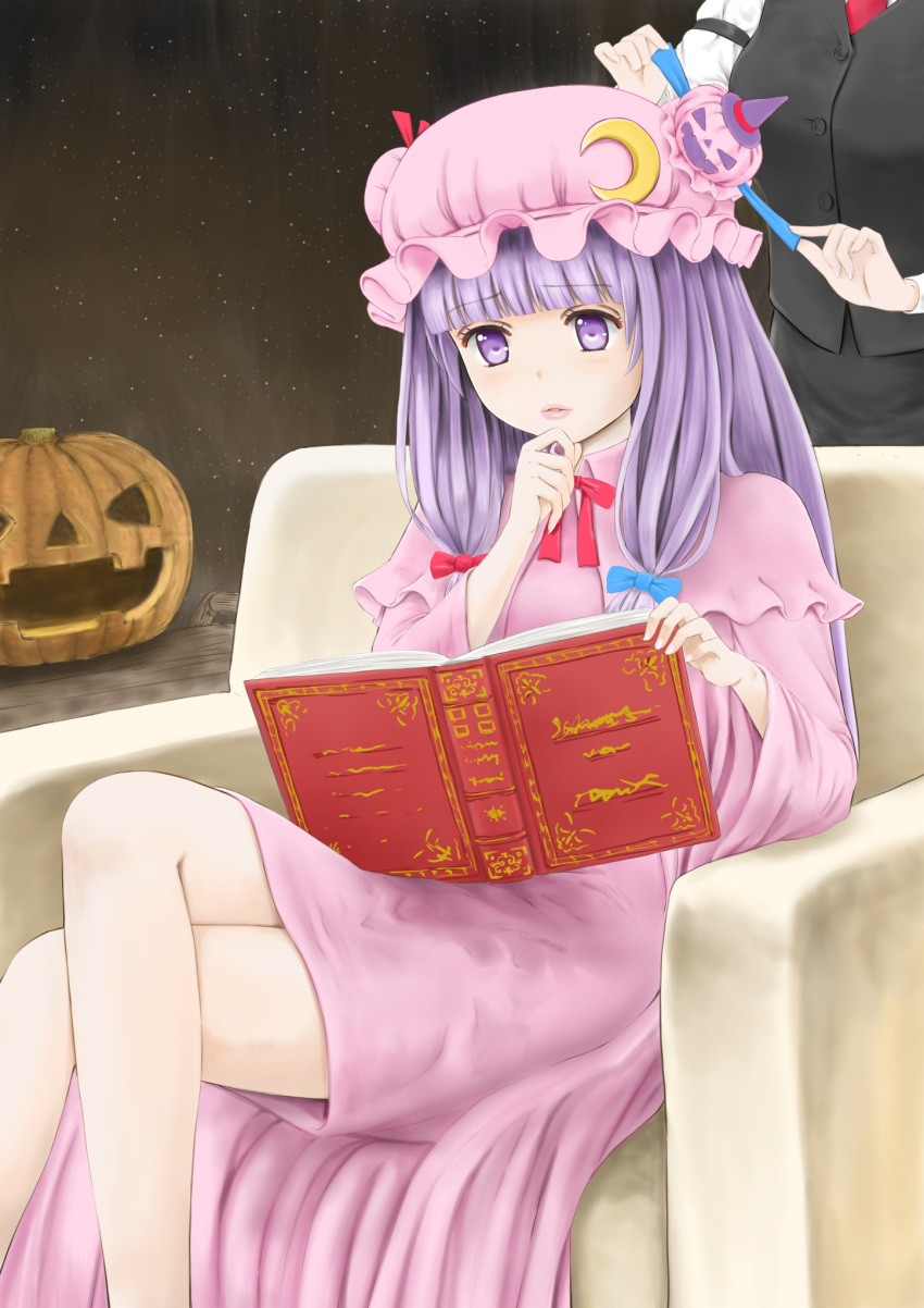 2girls armband bangs behind_another black_vest blunt_bangs book bosutonii crescent crescent_hair_ornament crossed_legs double_bun eyebrows_visible_through_hair feet_out_of_frame hair_ornament halloween hand_on_own_chin hat highres holding holding_book holding_ribbon jack-o'-lantern koakuma lavender_hair lips long_hair looking_down mob_cap multiple_girls necktie open_book out_of_frame parted_lips patchouli_knowledge pink_headwear pink_robe purple_eyes reading red_neckwear ribbon shirt sitting standing touhou tying very_long_hair vest waistcoat white_shirt witch_hat