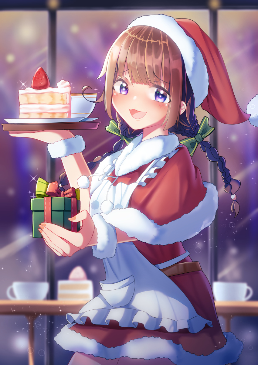 1girl :d absurdres bangs belt blurry blurry_background bow braid brown_hair cake coffee_mug cup eyebrows_visible_through_hair food fruit gift green_bow hair_bow hat highres looking_at_viewer mug open_mouth original pom_pom_(clothes) purple_eyes red_headwear santa_hat slice_of_cake smile solo standing strawberry tachibanashiro17 twin_braids wristband