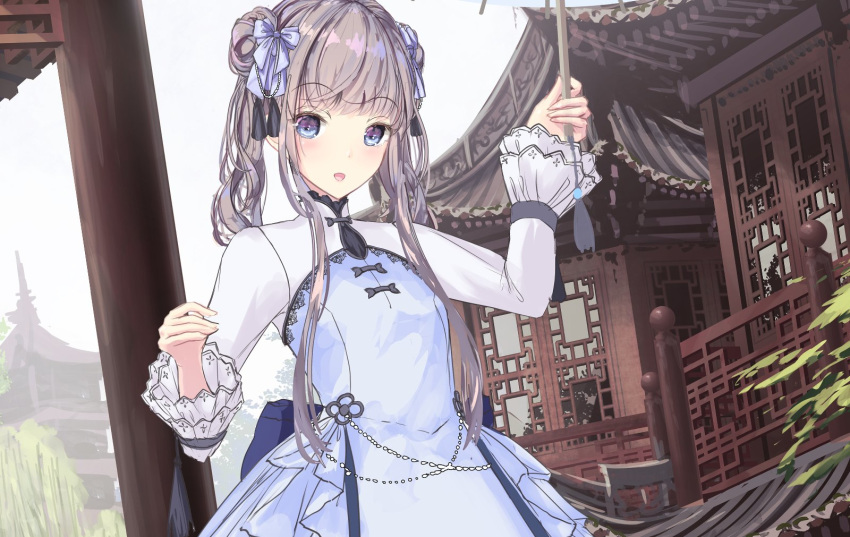 1girl :d arm_up bangs blue_bow blue_dress blue_eyes blush bow breasts brown_hair building day double_bun dress eyebrows_visible_through_hair hair_bow highres holding holding_umbrella long_hair long_sleeves looking_at_viewer missile228 open_mouth oriental_umbrella original outdoors railing small_breasts smile solo twintails umbrella very_long_hair
