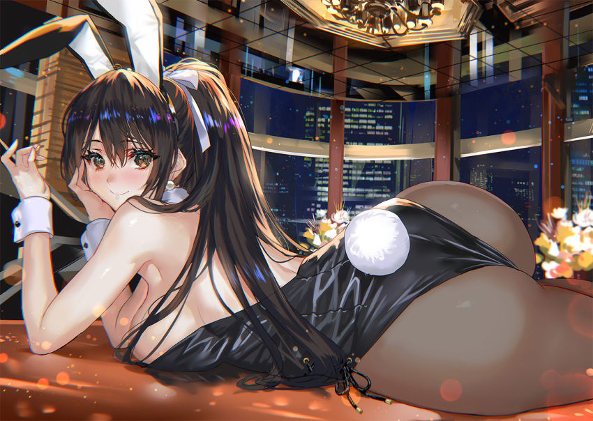 1girl animal_ears armpits ass bare_shoulders black_hair black_leotard breasts brown_eyes brown_legwear bunny_ears bunny_tail bunnysuit chandelier commentary_request earrings fake_animal_ears fake_tail hair_between_eyes hairband indoors jewelry large_breasts leotard long_hair looking_at_viewer looking_back lying night on_stomach original pantyhose ponytail ran'ou_(tamago_no_kimi) smile solo tail wrist_cuffs