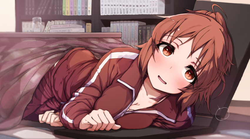 1girl abe_nana bangs blush book breasts brown_eyes brown_hair cleavage commentary_request highres idolmaster idolmaster_cinderella_girls jacket long_sleeves looking_at_viewer lying on_side open_mouth ponytail red_jacket short_hair smile solo table woshinon